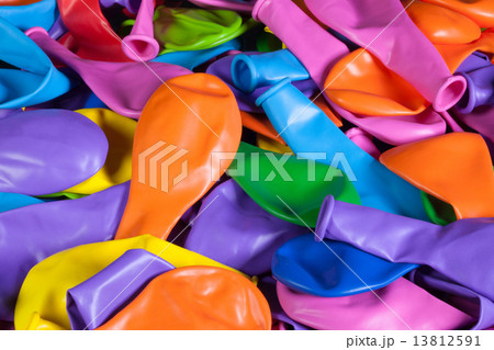 Colorful deflated balloons on the desk 13812591