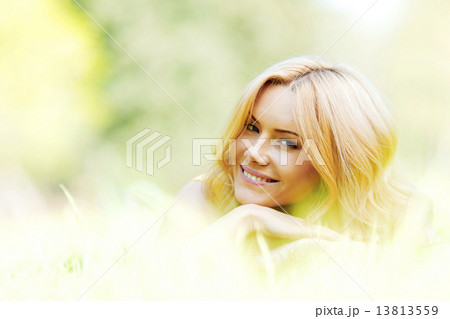 Young woman on grass Young woman on grass 13813559
