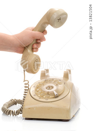 Hand hold vintage telephone cream color 13821504