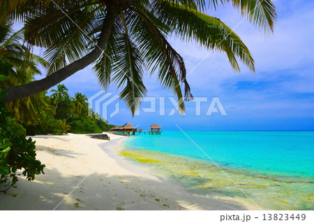 Water bungalows on beach of tropical island Water bungalows on beach of tropical island 13823449