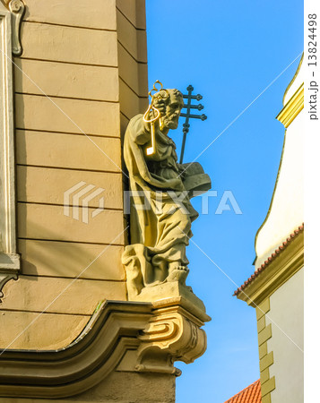 Saint Peter sculpture on a building in Prague 13824498
