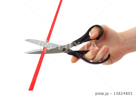 Hand with scissors and ribbon 13824805