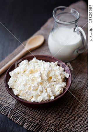Delicious homemade cottage cheese with milk on the table 13826667
