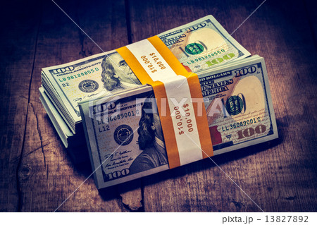 Stacks of new 100 US dollars 2013 banknotes bills 13827892