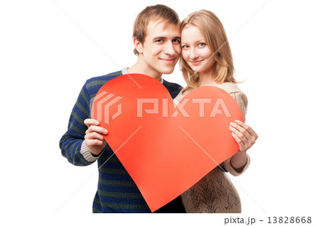 Couple holding sign in form of red heart 13828668