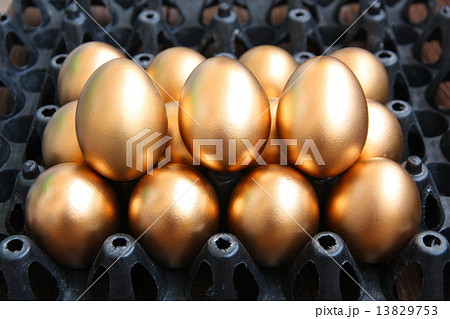 Golden eggs on black package 13829753