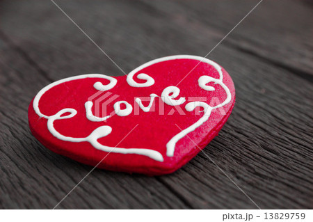Heart cookie on wood background 13829759
