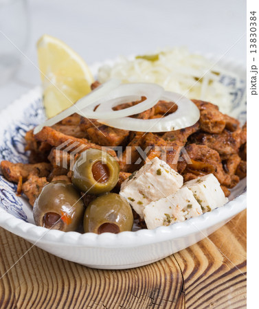 Gyros with Tzatziki Coleslaw olives and feta cheese Gyros with Tzatziki Coleslaw olives and feta cheese 13830384