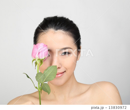 Beauty female lady woman posing holding  rose  13830972