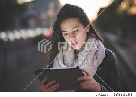 young beautiful long hair woman in town 13833261