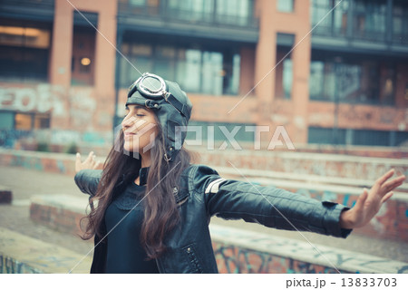 aviator young beautiful brunette woman with cap and glasses 13833703