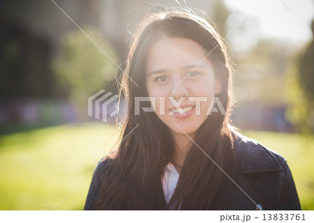 young beautiful long hair woman in town 13833761