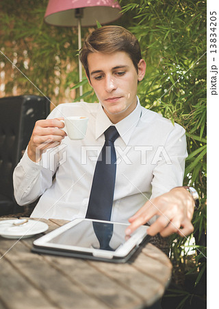 young handsome elegant blonde model businessman working with tab 13834205