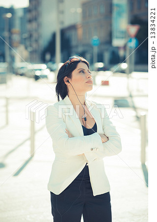 beautiful long black hair elegant business woman with earphones beautiful long black hair elegant business woman with earphones 13834221
