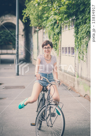 young hipster woman with bike young hipster woman with bike 13834917
