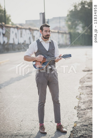 handsome big moustache hipster man playing mandolin handsome big moustache hipster man playing mandolin 13834958