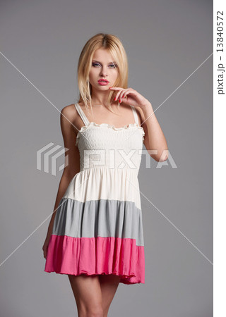 Beautiful blonde on gray background Beautiful blonde on gray background 13840572