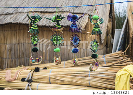Souvenir from reed on Floating islands Titicaca lake, Peru, Sout 13843325