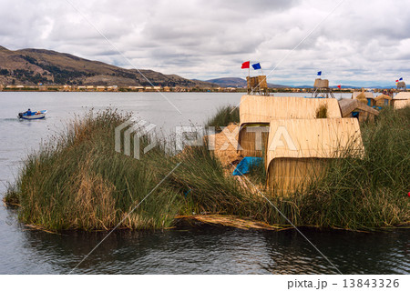 Thatched home on Floating Islands on Lake Titicaca, Puno, Peru, 13843326