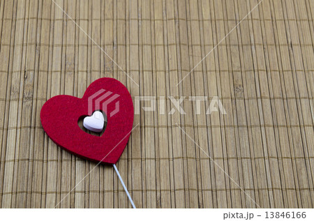 Big red heart with a smaller white heart inside 13846166