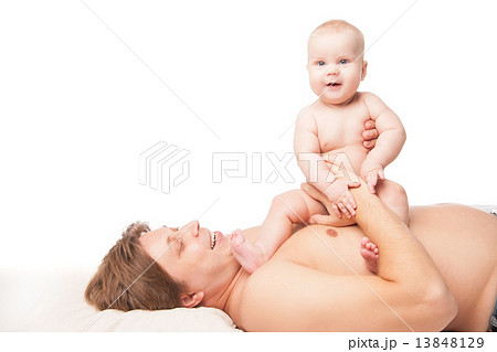 Happy kid boy and his dad lying on the floor 13848129