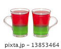Photo of two transparent glass cups with layered jelly cocktail 13853464