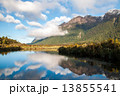 Lake, mirror lake with white puffy cloud on sunny day landscape with copy space 13855541