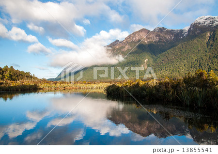 Lake, mirror lake with white puffy cloud on sunny day landscape with copy space 13855541
