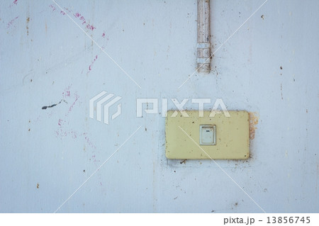 Old power switch on a dirty wall. Old power switch on a dirty wall. 13856745