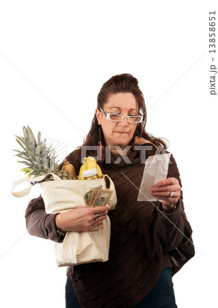 Grocery Shopper Reviewing Receipt 13858651