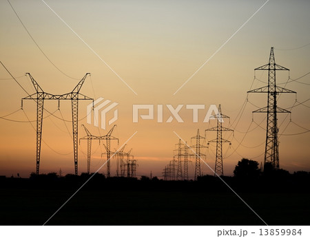 Large transmission towers at sunset 13859984