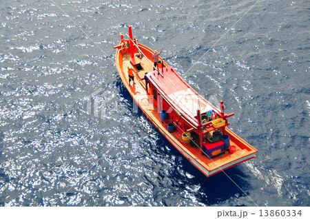 Fishing boat heading out to the gulf in the early morning Fishing boat heading out to the gulf in the early morning 13860334