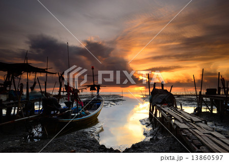 fishing boat with sunrise background 13860597