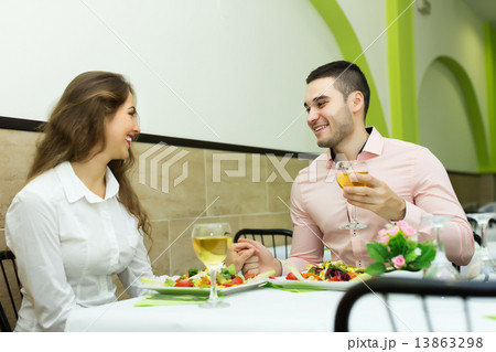 happy couple having dinner at the restaurant 13863298