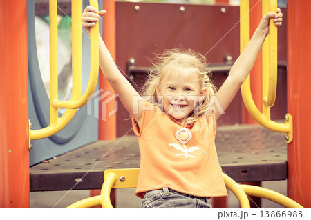 Happy little girl on the playground Happy little girl on the playground 13866983