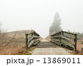 small bridge leading to a path on a misty morning with top copy space 13869011