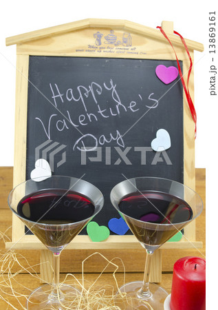 Blackboard with hearts and and two glasses 13869161