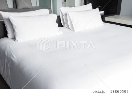 White bed sheets and pillows 13869592