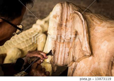 Traditional craftsman carving wood Traditional craftsman carving wood 13873119