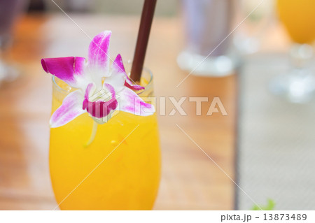 Glass of iced orange juice 13873489