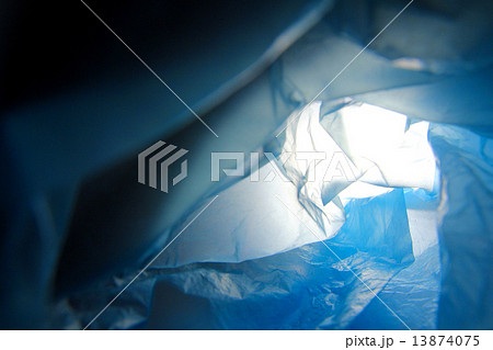 Abstract background of the insides of a blue plastic bag with different color shades Abstract background of the insides of a blue plastic bag with different color shades 13874075