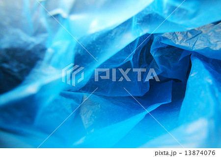 Abstract background of the insides of a blue plastic bag with different color shades Abstract background of the insides of a blue plastic bag with different color shades 13874076