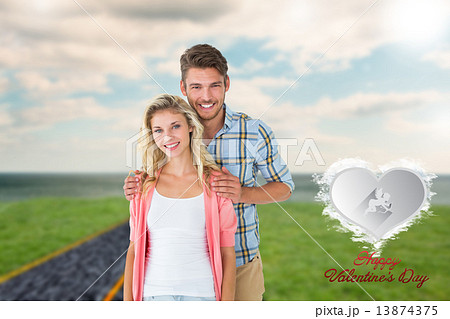 Composite image of attractive young couple smiling at camera Composite image of attractive young couple smiling at camera 13874375