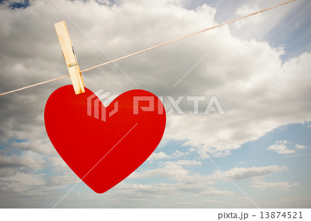 Composite image of heart hanging on line Composite image of heart hanging on line 13874521