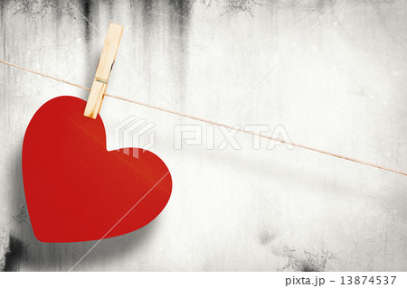 Composite image of heart hanging on line 13874537