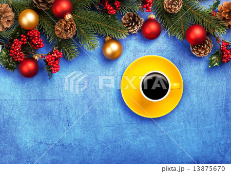 Hot coffee and pine branch with christmas balls on blue backgrou 13875670