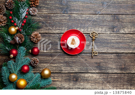 Cappuccino with christmas tree shape and pine branch on wooden t 13875840