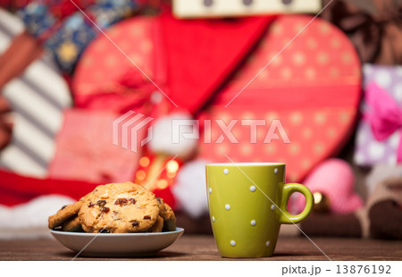 Cookie and cup of coffee on christmas background. 13876192
