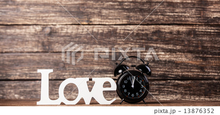 Word Love and alarm clock. 13876352