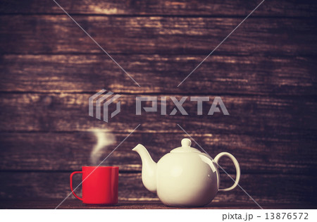 Teapot and cup of tea Teapot and cup of tea 13876572
